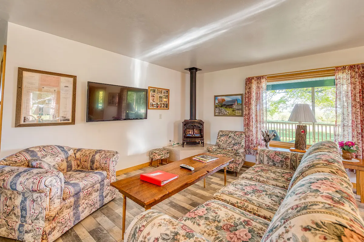 A living room with couches and chairs in it