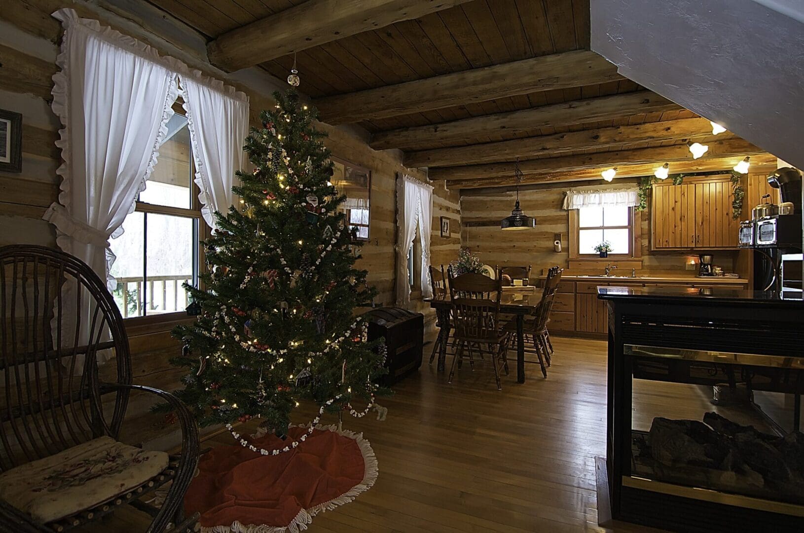 A christmas tree in the middle of a room.